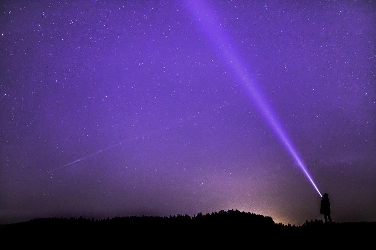night photograph, flashlight, ray, starry sky
